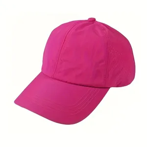 Pink quick-dry baseball cap detail showing breathable mesh panels and curved brim for outdoor sports.