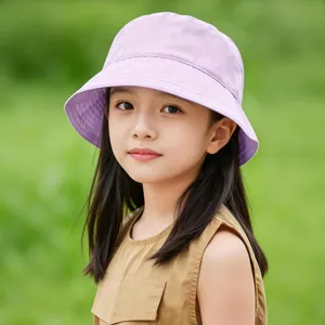 Detailed shot of a cute child wearing a stylish light purple bucket hat for outdoor sun protection.