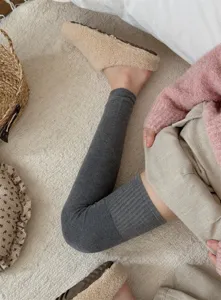 Thickened wool over-knee leg warmers for women, cozy winter thermal long socks for cold weather.