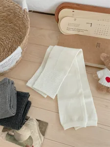 Thickened knitted over-knee leg warmers for women, cozy winter thermal long socks.