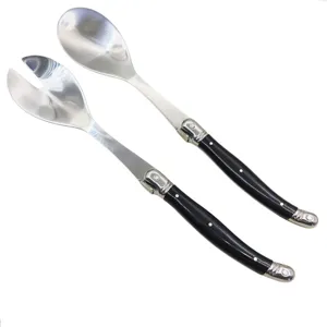 Stainless steel salad serving spoon and fork set with black handle for dining table.
