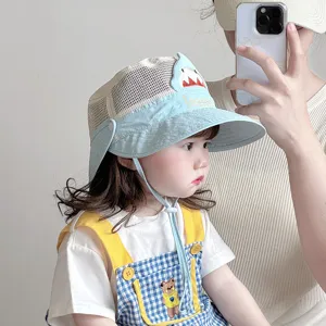 Detailed view of cute baby mesh sun hat with cartoon shark design and neck flap.