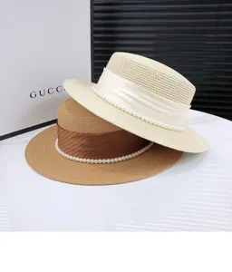Flat top straw hat for women, summer sun protection wide brim pearl decorated vintage hat detail.