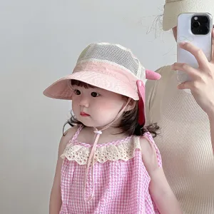 Baby sun protection hat detail, cute pink mesh toddler bucket hat for outdoor summer wear.