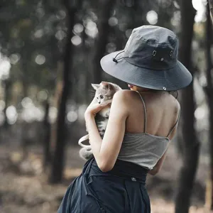 Detailed view of the outdoor sun bucket hat in deep grey, showing breathable eyelets and wide brim.
