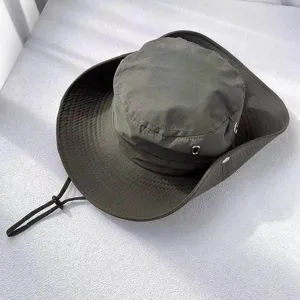 Detail view of the dark green outdoor sun protection bucket hat with wide brim and adjustable strap.