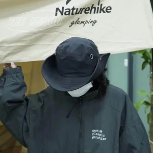 Detailed close-up shot of outdoor sun protection bucket hat and windbreaker jacket.