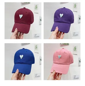 Heart embroidered baseball cap detail shot, showing cute soft top design for daily wear.