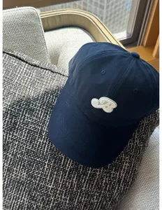 Korean style navy blue baseball cap with cute embroidered B patch, curved brim summer sun hat.