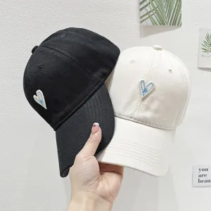 Heart embroidered baseball cap for women, casual soft top dad hat with heart design.