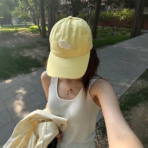 Korean style yellow baseball cap with cute embroidery, curved brim summer sun protection hat.