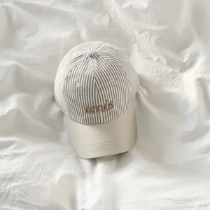 Korean striped embroidered baseball cap for women, stylish sun hat with letter design.