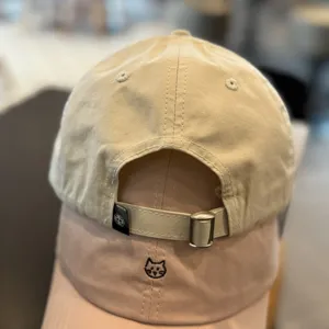 Cat embroidery baseball cap detail, adjustable strap design, casual cotton sun hat for daily wear.