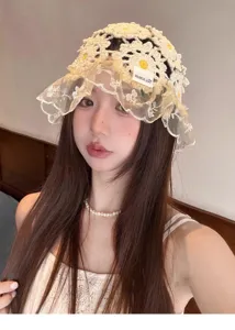 Crochet lace bucket hat detail, hollow out floral design for women sun protection.