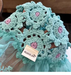 Close-up detail of the Japanese crochet floral fisherman hat showing hollow knit texture.