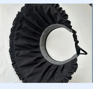 Detail view of the black empty top sun hat with ruffle brim and adjustable strap.
