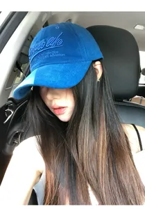 Retro letter embroidered blue baseball cap for women, wide brim sun hat with Korean casual style.