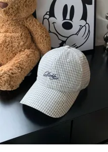 Close-up detail of the Korean style plaid baseball cap with delicate front embroidery and brim.
