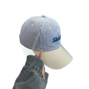 Blue and white striped baseball cap with beige curved brim, stylish embroidered sun hat for women.