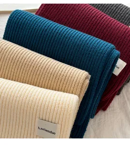 Thick ribbed knit winter scarf in multiple solid colors, cozy warm neck warmer for cold weather.