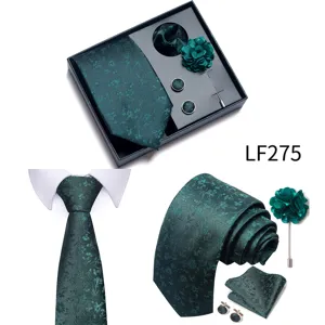 Detail view of dark green floral jacquard men tie set with pocket square and cufflinks