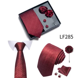 Men's burgundy jacquard tie gift box set, detail view showing tie, pocket square, and accessories.