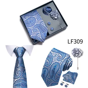 Detailed view of blue paisley tie pocket square cufflinks and lapel flower gift set.