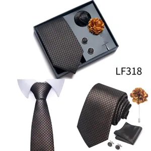 Detail view of men's jacquard tie set, including pocket square, cufflinks, and flower.