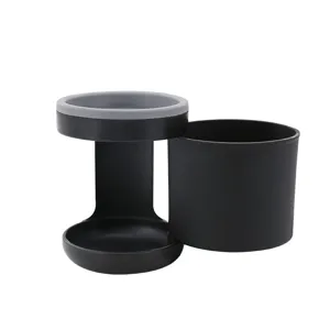 Detail shot of black walker cup holder, versatile bottle holder for wheelchair and stroller use.