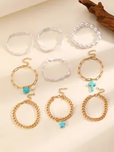 Boho multi-piece bracelet set featuring chic turquoise cross and star charms for women.