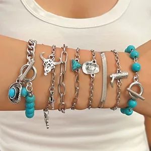 Detailed view of the bohemian turquoise layered chain bracelet set, vintage western style jewelry.