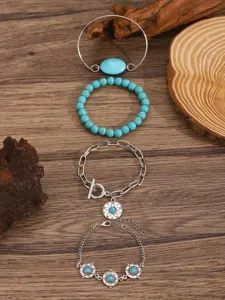 Detail view of Bohemian turquoise stone charm bracelet set, featuring ethnic metal chain styles.
