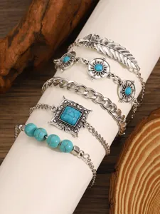 Bohemian multi-layer turquoise bracelet set, vintage silver feather and gemstone detail.