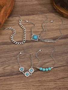 Bohemian silver turquoise multi-layer bracelet set detail showcasing intricate boho charms.
