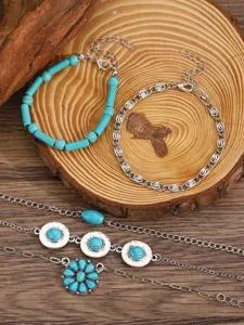 Bohemian turquoise layered bracelet set with silver chains and ethnic charm details.