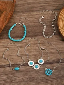 Detailed view of bohemian turquoise stone charm bracelet set, vintage multi-layer chain design.