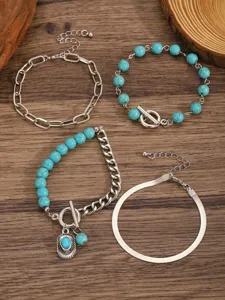 Bohemian multi-layer turquoise stone and silver chain bracelet set, stylish detail view.
