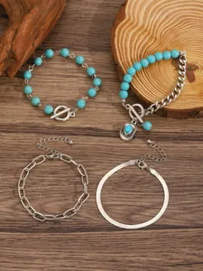 Detailed view of bohemian style turquoise bead and chain bracelet set for women fashion accessories.