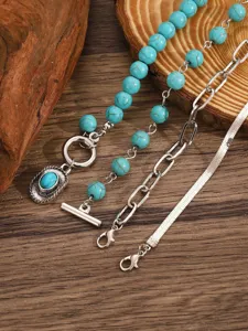 Turquoise multi-layer bracelet detail, Bohemian vintage style metal chain and stone beads.
