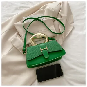 Green tweed leather shoulder bag with golden metal handle and chic H-clasp design.