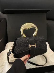 Chic black crossbody shoulder bag with sequin flap and unique gold handle for women.