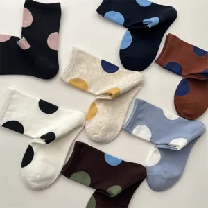 Colorful polka dot mid-calf socks detail showing various color combinations and soft cotton fabric.