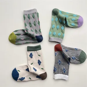 Retro cute cotton crew socks with colorful geometric patterns, polka dots, and floral embossed designs.