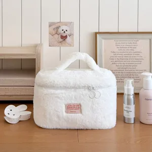 Fluffy cosmetic bag, soft plush toiletry organizer, cute large capacity travel makeup bag.