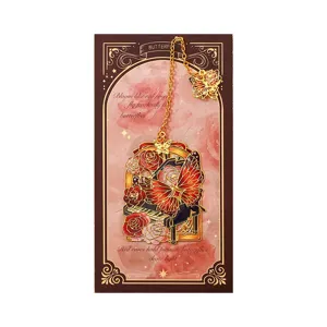 Vintage metalen holle bladwijzer vlinder piano ontwerp met elegante cadeaukaart