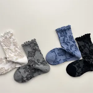 Detailed view of vintage ruffle floral crew socks, showcasing delicate relief pattern texture.