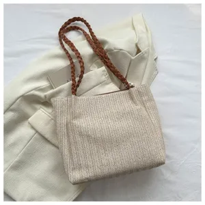 Woven straw tote bag for women, large capacity shoulder bag with braided handles, casual spring fashion handbag.