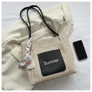 Fashion straw woven tote bag for women, casual summer shoulder bag with black pocket and scarf.