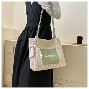 Stylish woven straw tote bag for women, large capacity shoulder bag with chic scarf decoration.