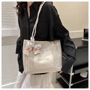 Woven straw tote bag for women, large capacity shoulder bag with summer letter print.